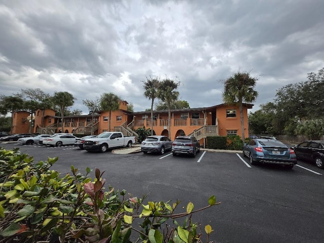 uncovered parking lot with a residential view and stairway