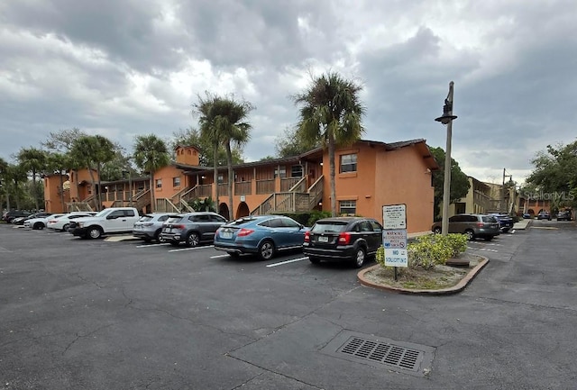 uncovered parking lot with a residential view and stairway