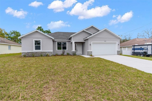 single story home featuring a garage, a front yard, stone siding, and concrete driveway