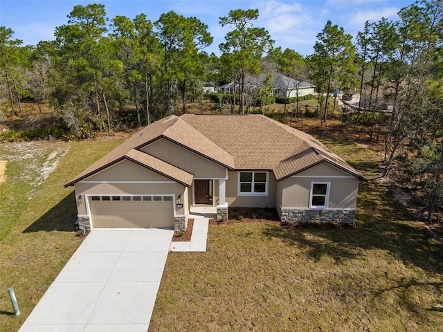 single story home featuring a garage, stone siding, driveway, stucco siding, and a front yard