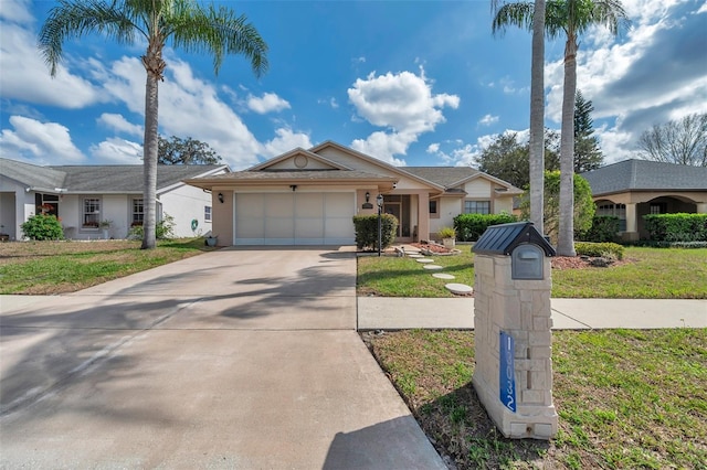 ranch-style home with an attached garage, driveway, and a front lawn