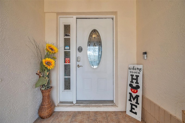 property entrance featuring stucco siding