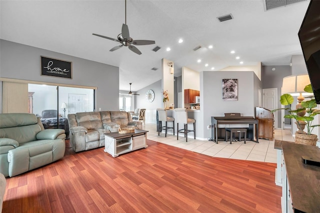 living room with light wood-style floors and visible vents