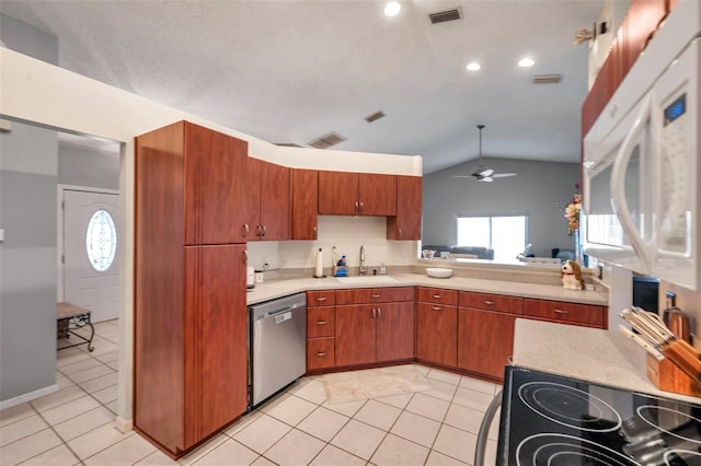 kitchen featuring light countertops, dishwasher, visible vents, and a sink