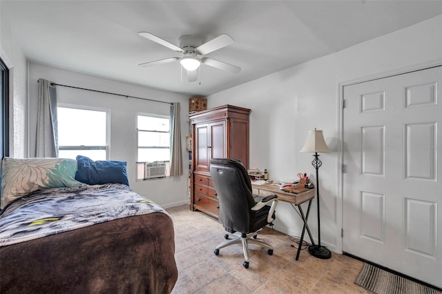 bedroom with ceiling fan, baseboards, and cooling unit