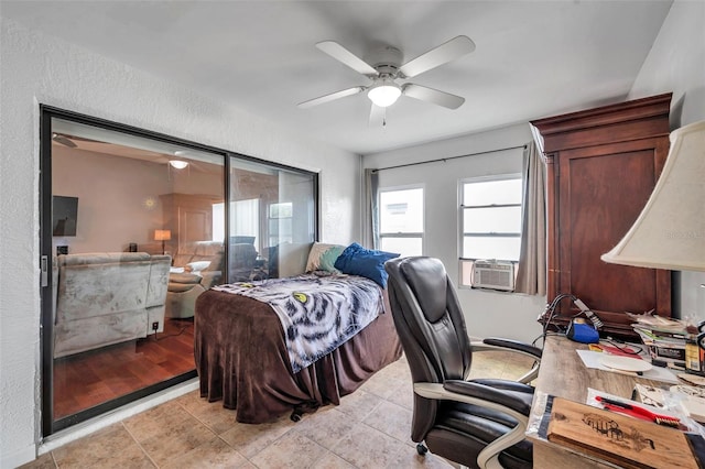 bedroom with a ceiling fan, cooling unit, a textured wall, and light tile patterned floors