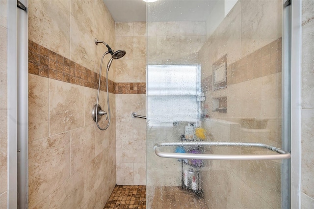 bathroom featuring tiled shower