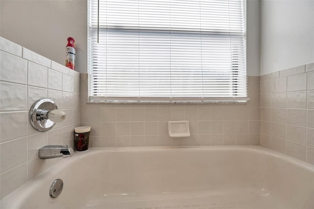 bathroom with a garden tub