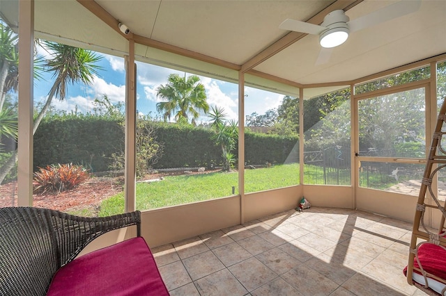 sunroom / solarium featuring ceiling fan and a healthy amount of sunlight