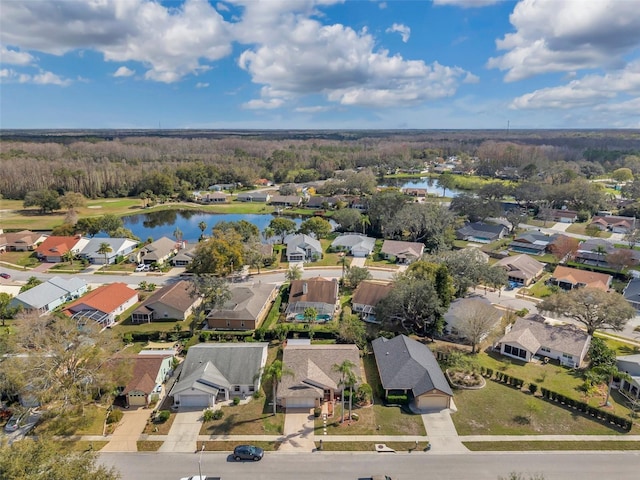 bird's eye view with a residential view and a water view