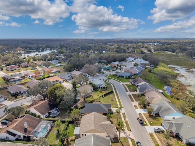 bird's eye view with a residential view and a water view