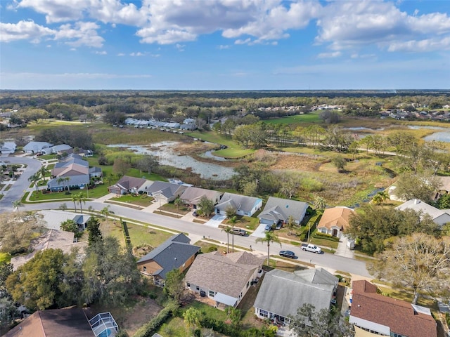 bird's eye view with a water view and a residential view