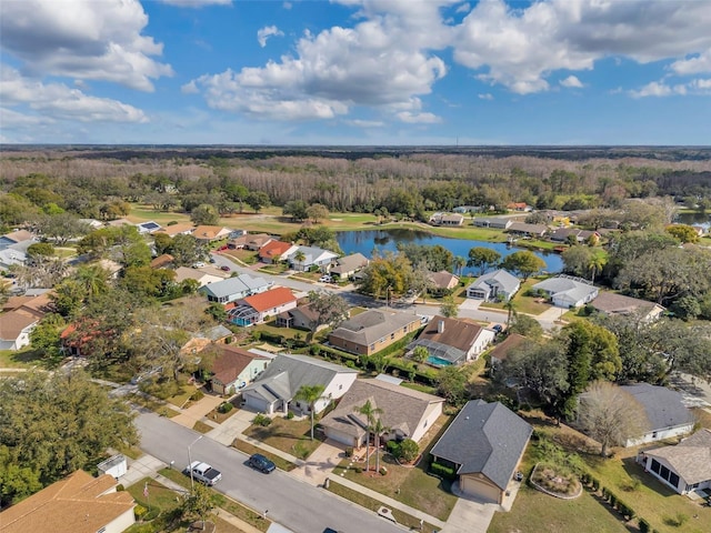 birds eye view of property with a residential view and a water view