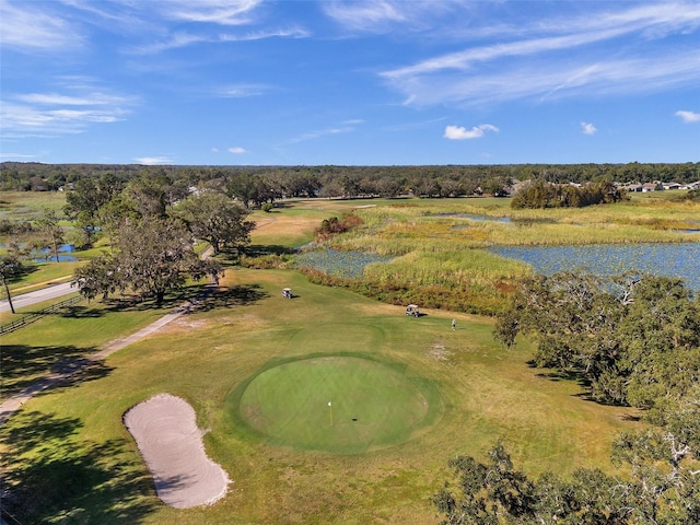 bird's eye view featuring view of golf course and a water view