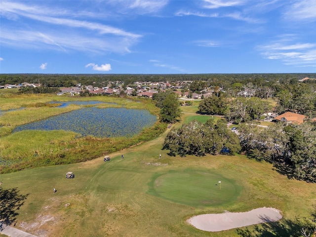 drone / aerial view featuring a water view and golf course view