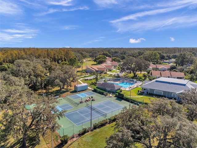 birds eye view of property with a residential view and a view of trees