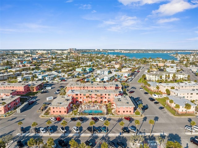 birds eye view of property with a water view and a city view