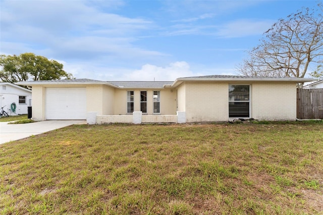 ranch-style house with driveway, an attached garage, fence, a front lawn, and brick siding