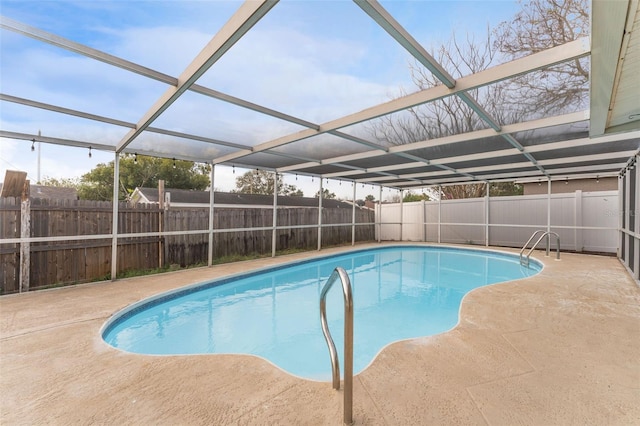 view of pool with a patio, a fenced backyard, a lanai, and a fenced in pool