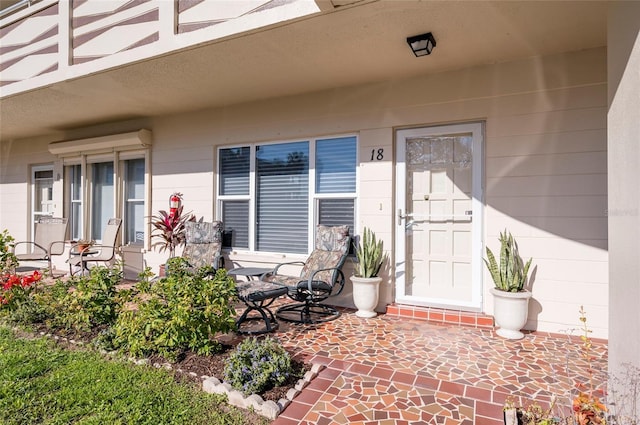 property entrance featuring a porch