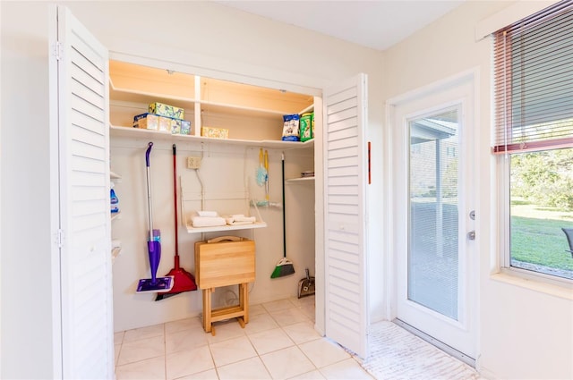 mudroom with light tile patterned flooring and plenty of natural light