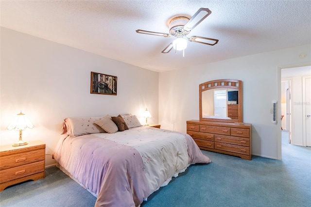 bedroom featuring a textured ceiling, carpet floors, ceiling fan, and baseboards