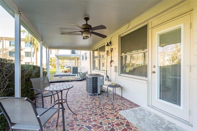 view of patio / terrace with central AC unit and a ceiling fan