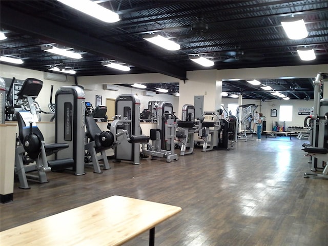 exercise room featuring dark wood-type flooring