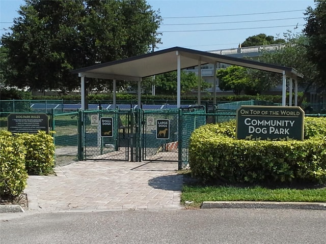 surrounding community with fence and a gate