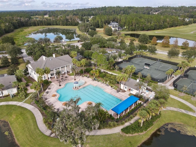 bird's eye view with a water view and a view of trees