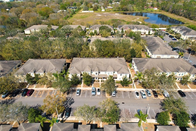 bird's eye view with a residential view and a water view