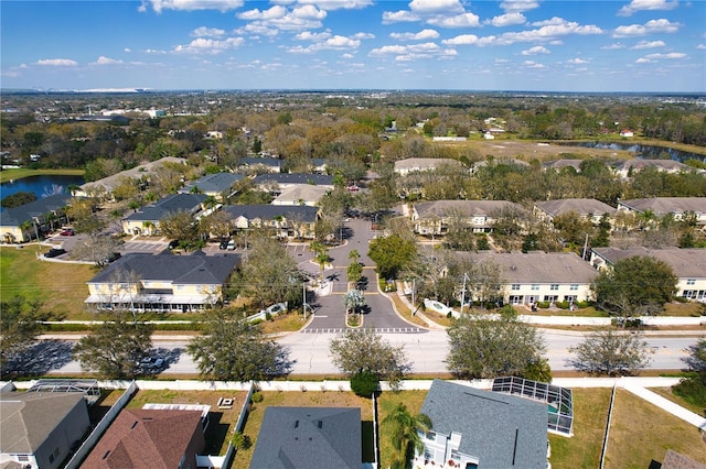 aerial view featuring a water view and a residential view