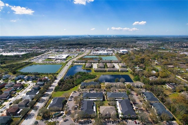 bird's eye view featuring a water view and a residential view