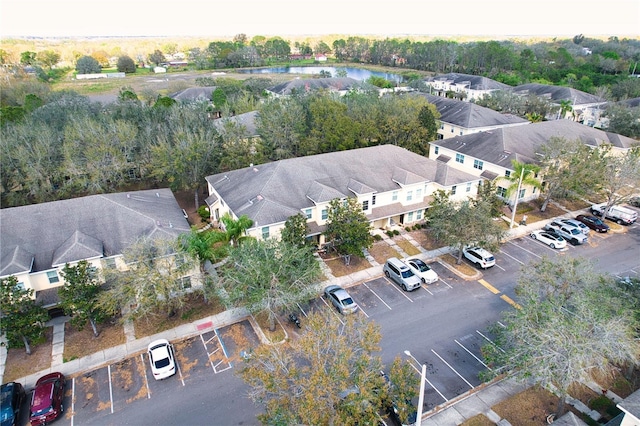 bird's eye view with a water view and a residential view