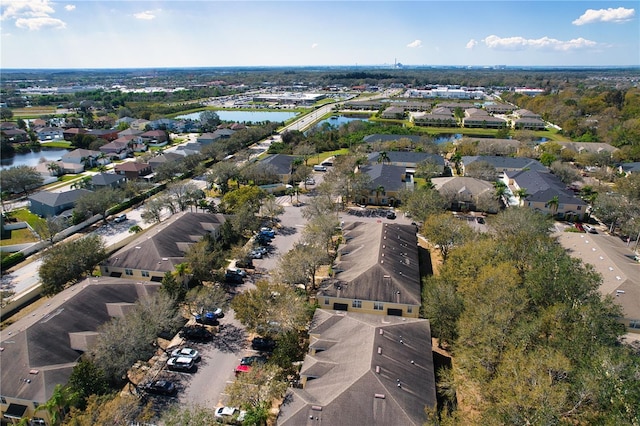 bird's eye view featuring a water view and a residential view