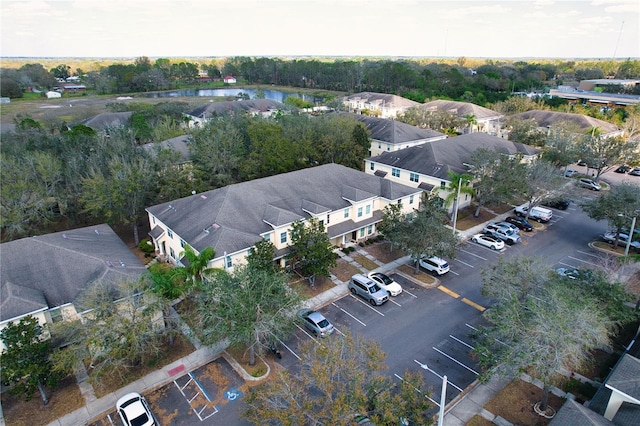 aerial view with a residential view and a water view