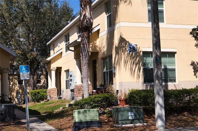 view of building exterior featuring central AC unit