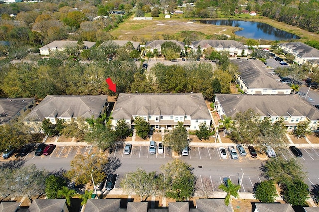 bird's eye view with a water view and a residential view