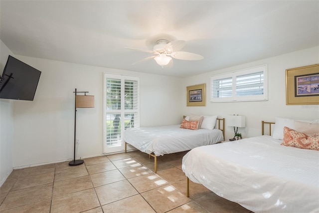 bedroom featuring ceiling fan and light tile patterned flooring