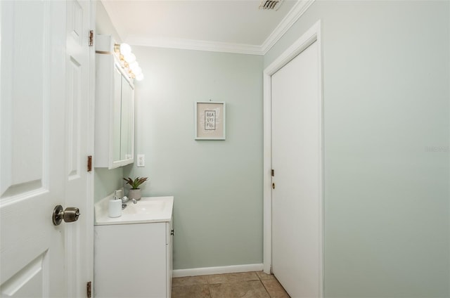 bathroom with crown molding, visible vents, vanity, baseboards, and tile patterned floors