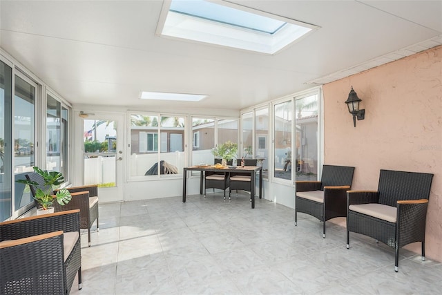 sunroom / solarium featuring a skylight