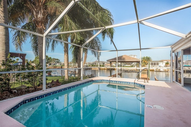 pool with a water view and a lanai