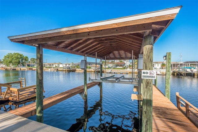 view of dock featuring a water view and boat lift