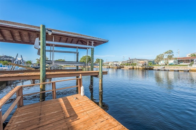 view of dock featuring a water view and boat lift