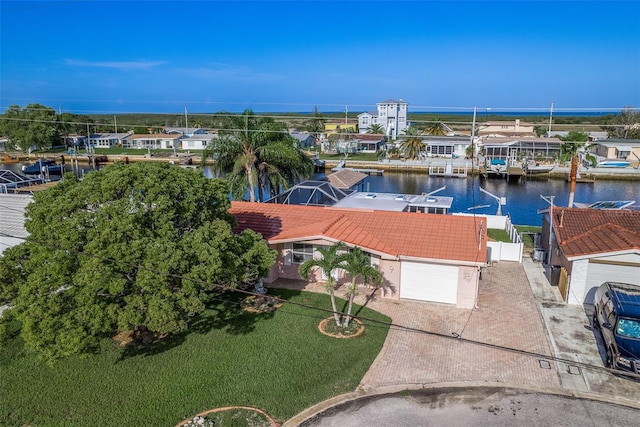 bird's eye view featuring a water view and a residential view