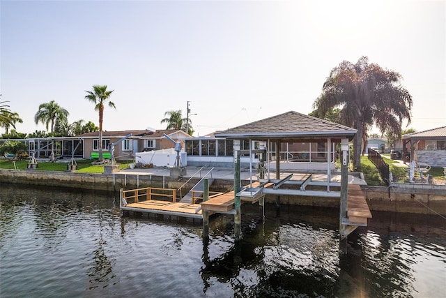 dock area featuring a water view and boat lift