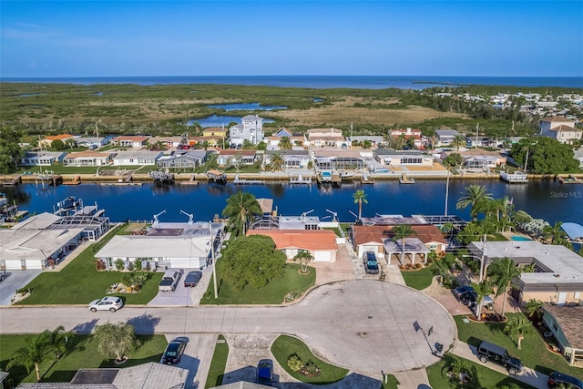 birds eye view of property featuring a water view and a residential view