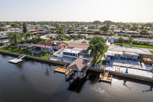 bird's eye view with a water view and a residential view