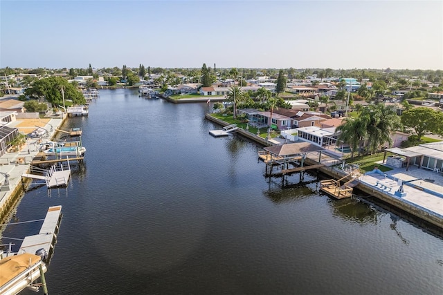 bird's eye view with a water view and a residential view