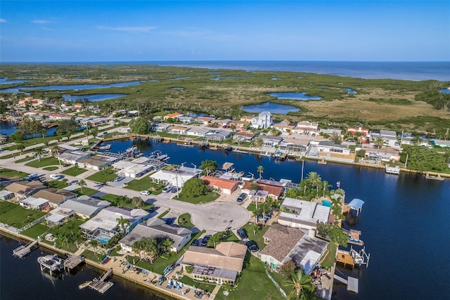 bird's eye view featuring a water view and a residential view